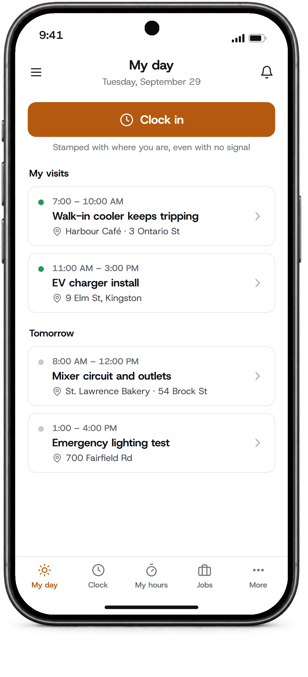The OhmDesk crew app on a phone: a technician's day with a Clock in button and two visits.